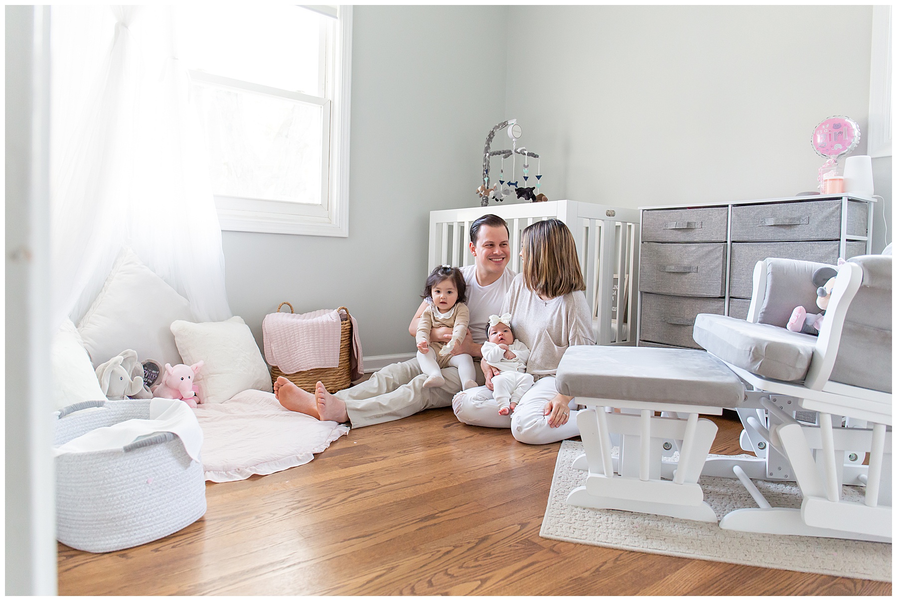 Family in baby nursery