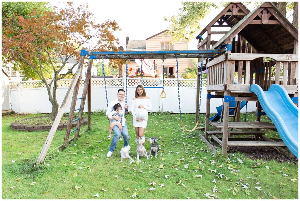 backyard family photo in swing in new home