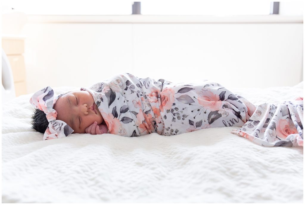 newborn baby on bed