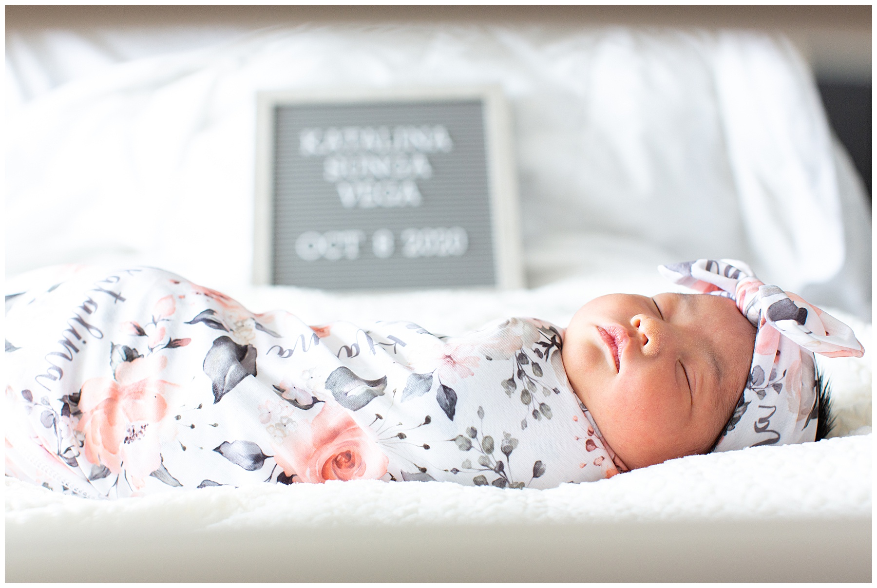 newborn on hospital bed