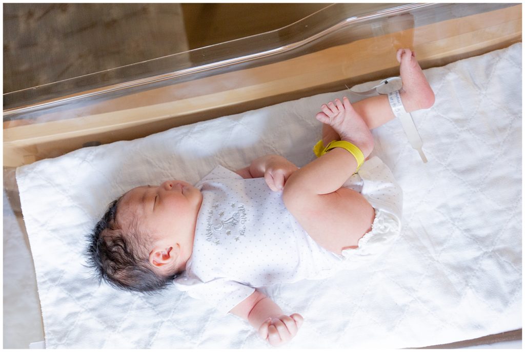 sleeping baby on hospital crib