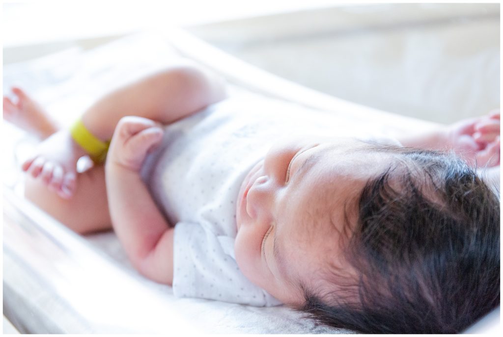 newborn on hospital crib