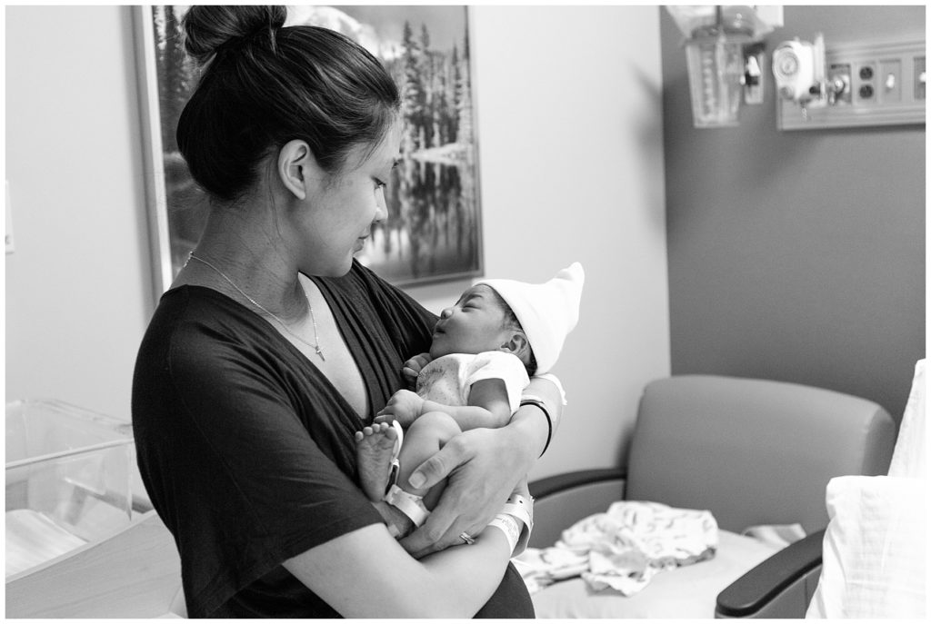 Mom holding baby in hospital